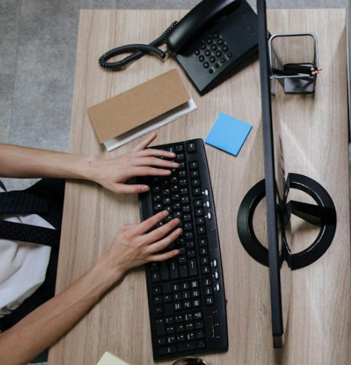 HR professional managing job applications on Skilled Workers Cloud recruitment software